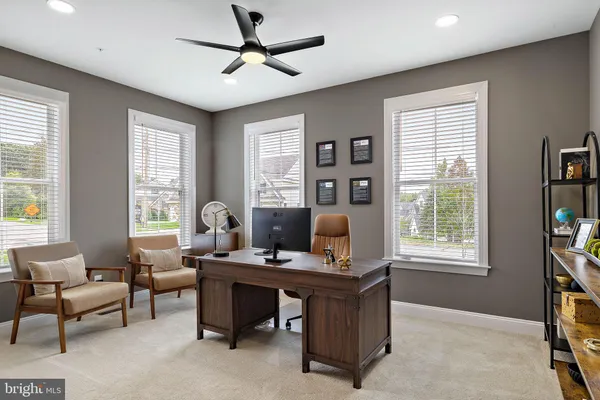 a work room with furniture and windows