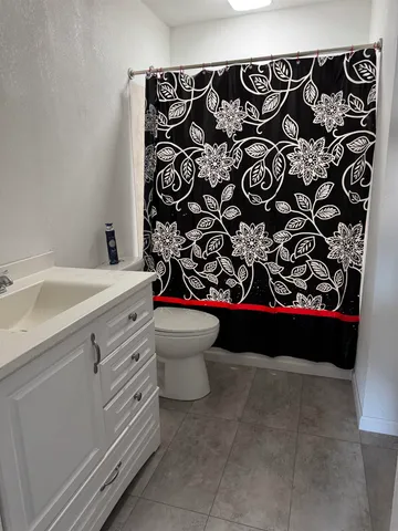 a bathroom with a sink and mirror