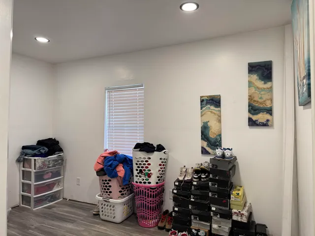 a view of a room with wooden floor and closet