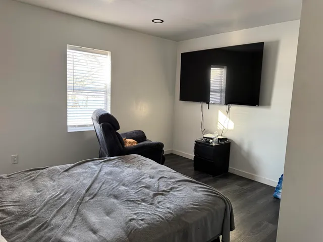 a bedroom with a bed and walk in closet