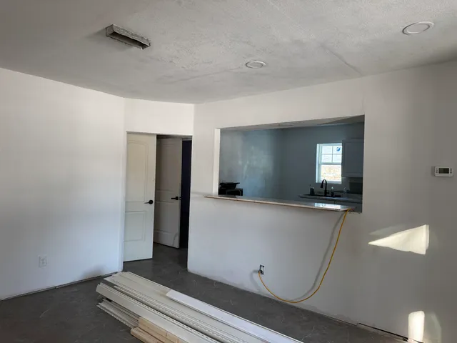 a view of an empty room and window