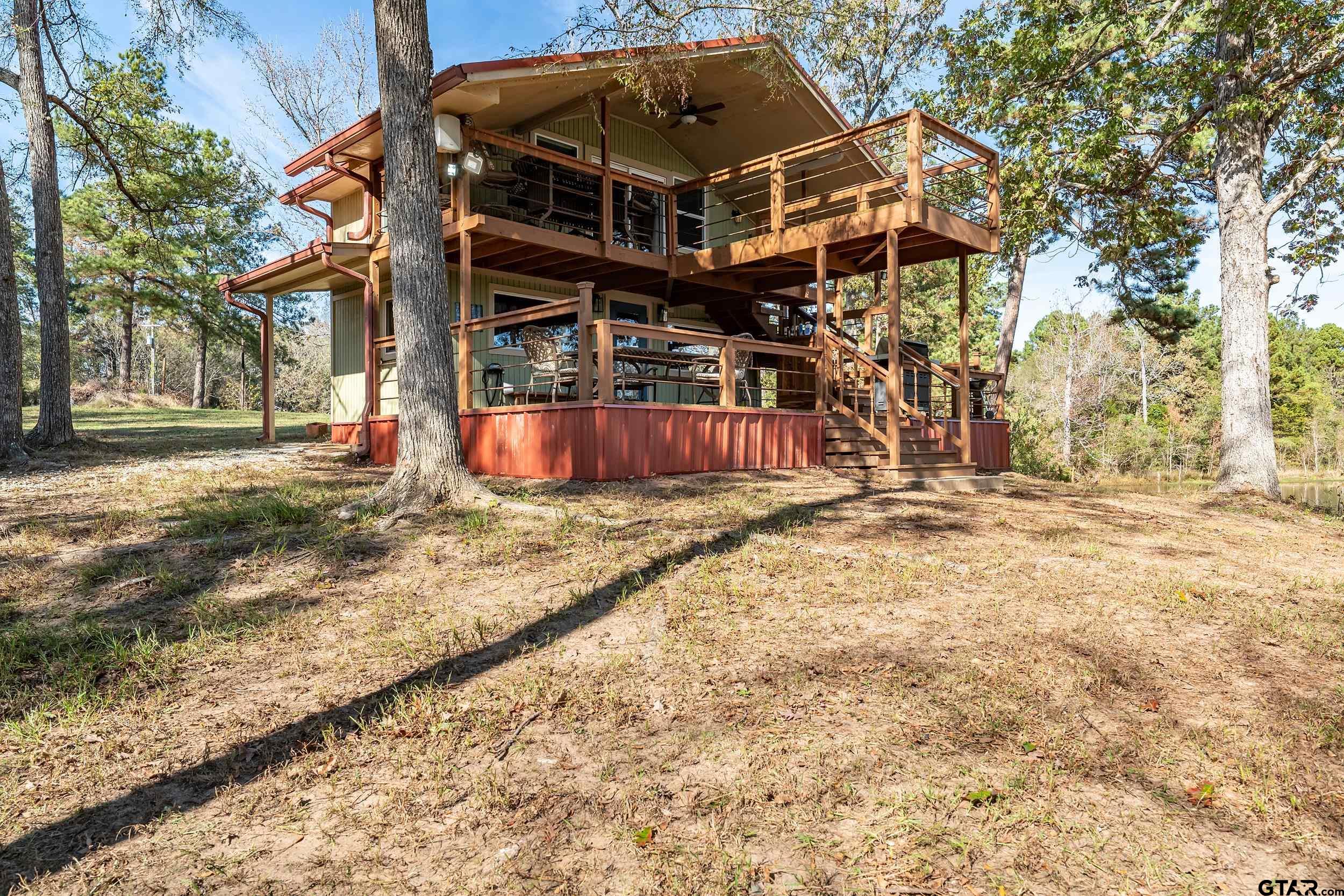 a view of a house with basketball court