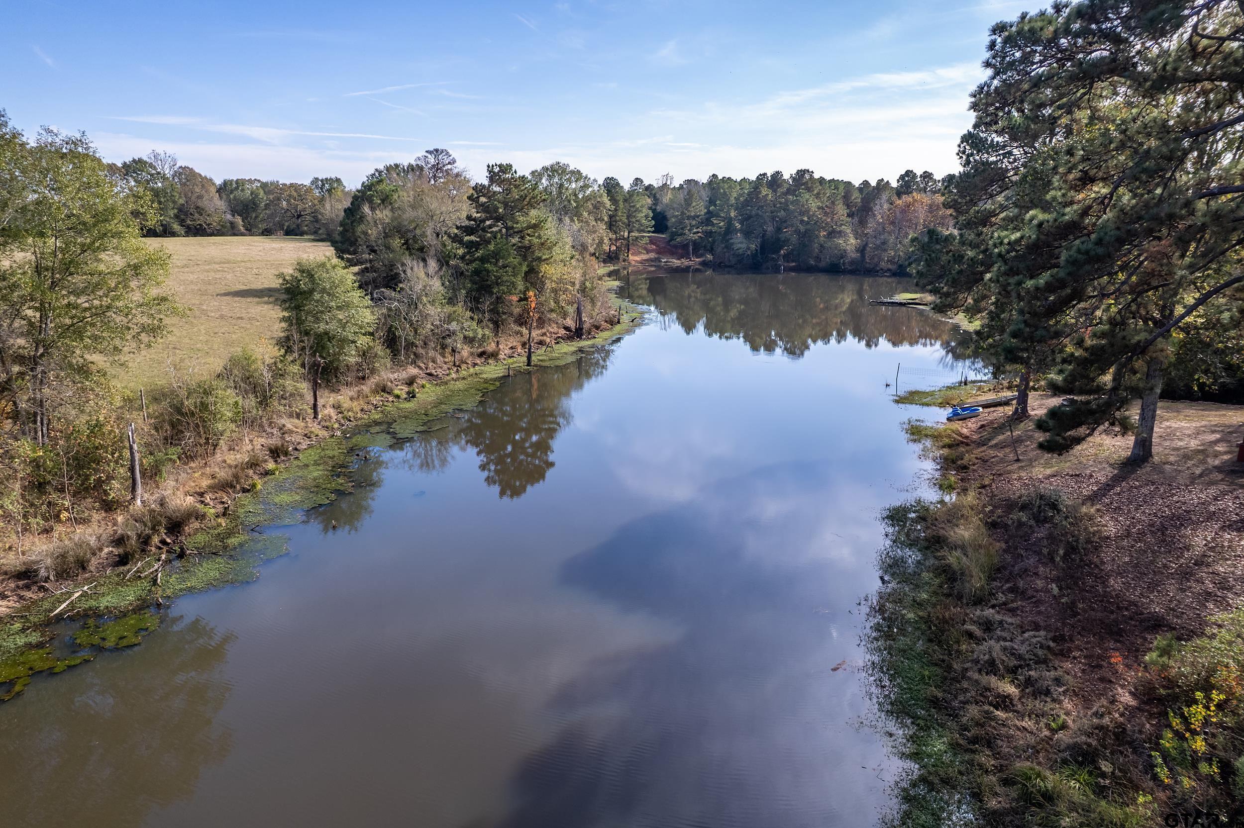 197 Cr 2304 Rusk Tx 75785 Rusk, TX 75785 - Photo 15 of 33 a view of a lake in between two and trees