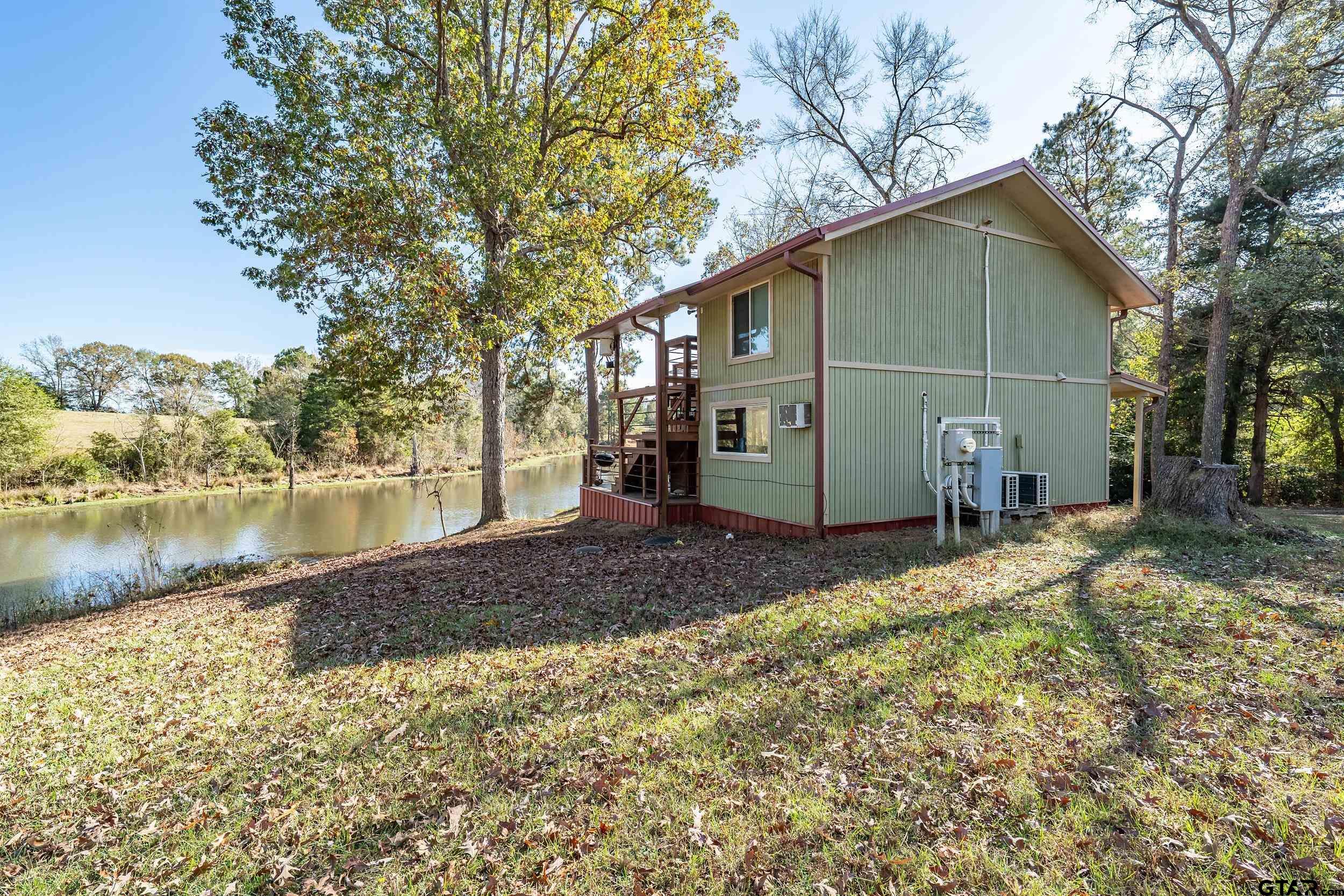 197 Cr 2304 Rusk Tx 75785 Rusk, TX 75785 - Photo 19 of 33 a view of a house with a yard and lake view