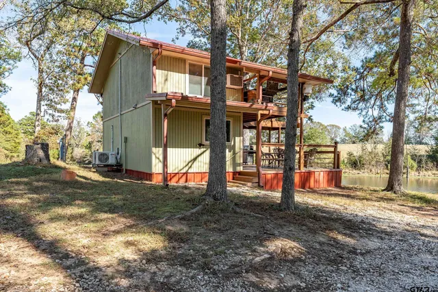 a view of street with large trees
