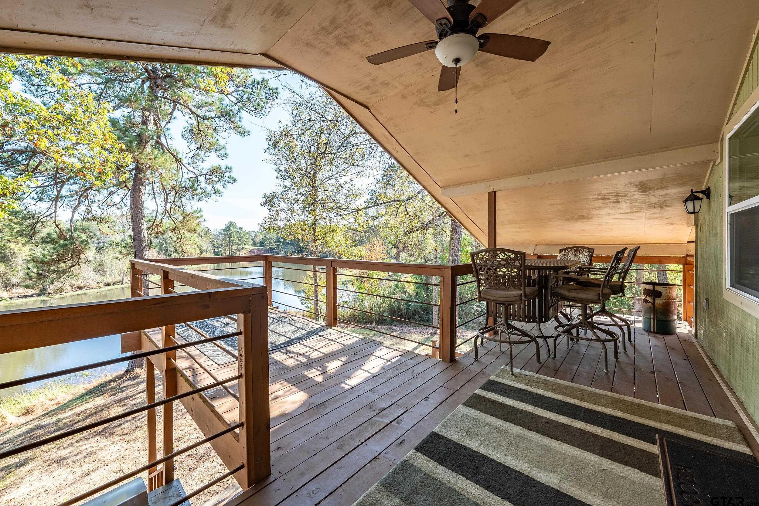 197 Cr 2304 Rusk Tx 75785 Rusk, TX 75785 - Photo 22 of 33 a view of a porch with furniture and a yard