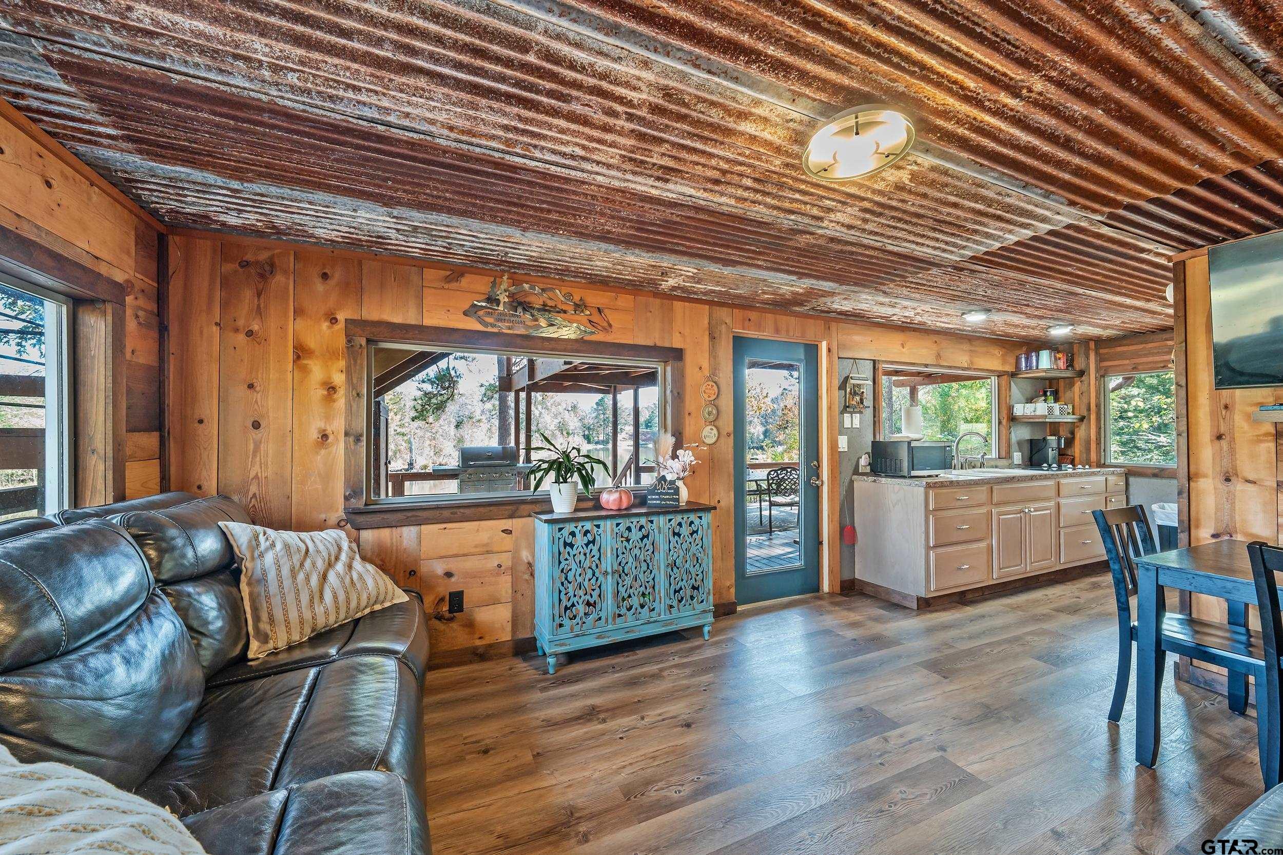 197 Cr 2304 Rusk Tx 75785 Rusk, TX 75785 - Photo 25 of 33 a living room with furniture and a wooden floor