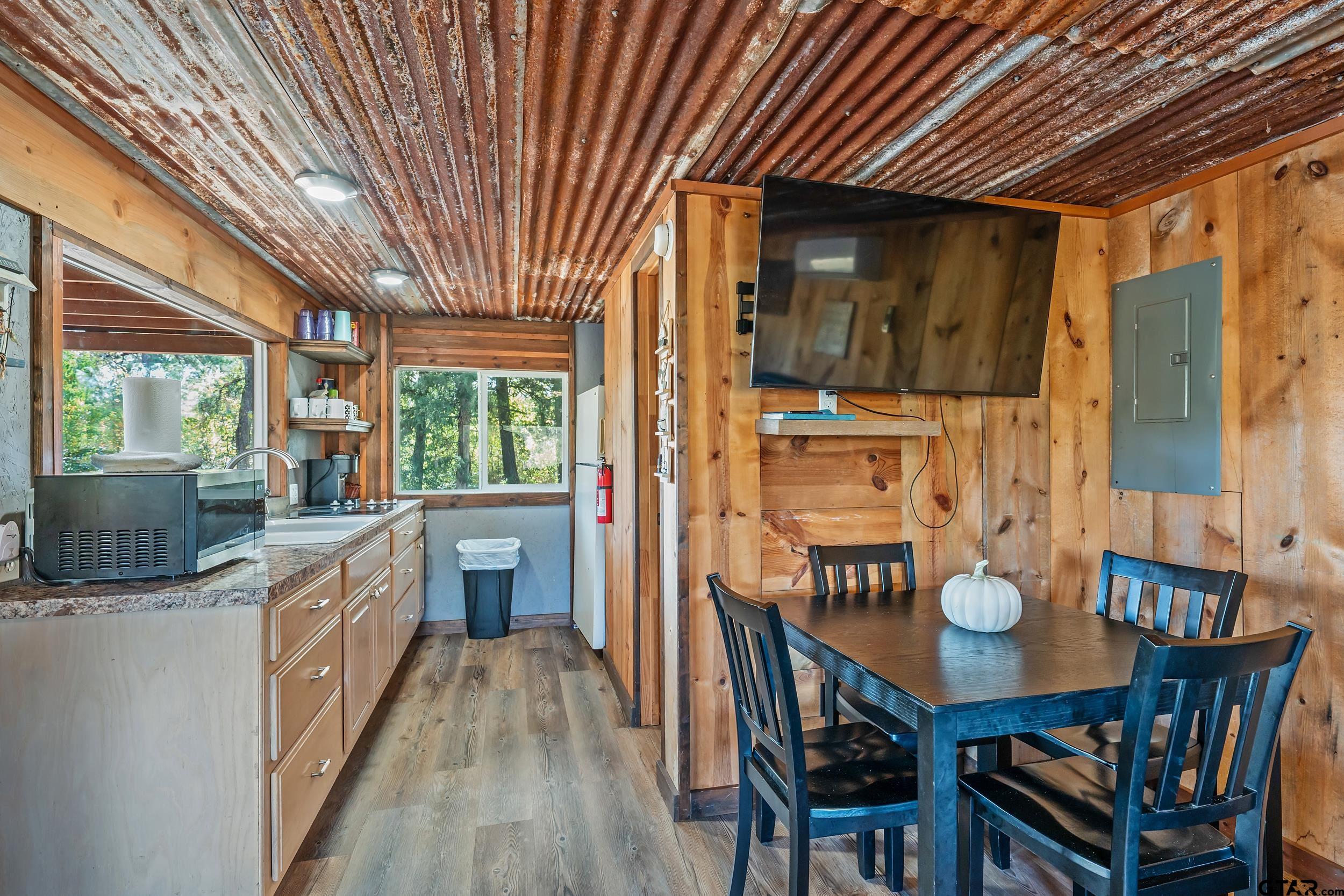 197 Cr 2304 Rusk Tx 75785 Rusk, TX 75785 - Photo 26 of 33 a view of a dining room with furniture window and wooden floor