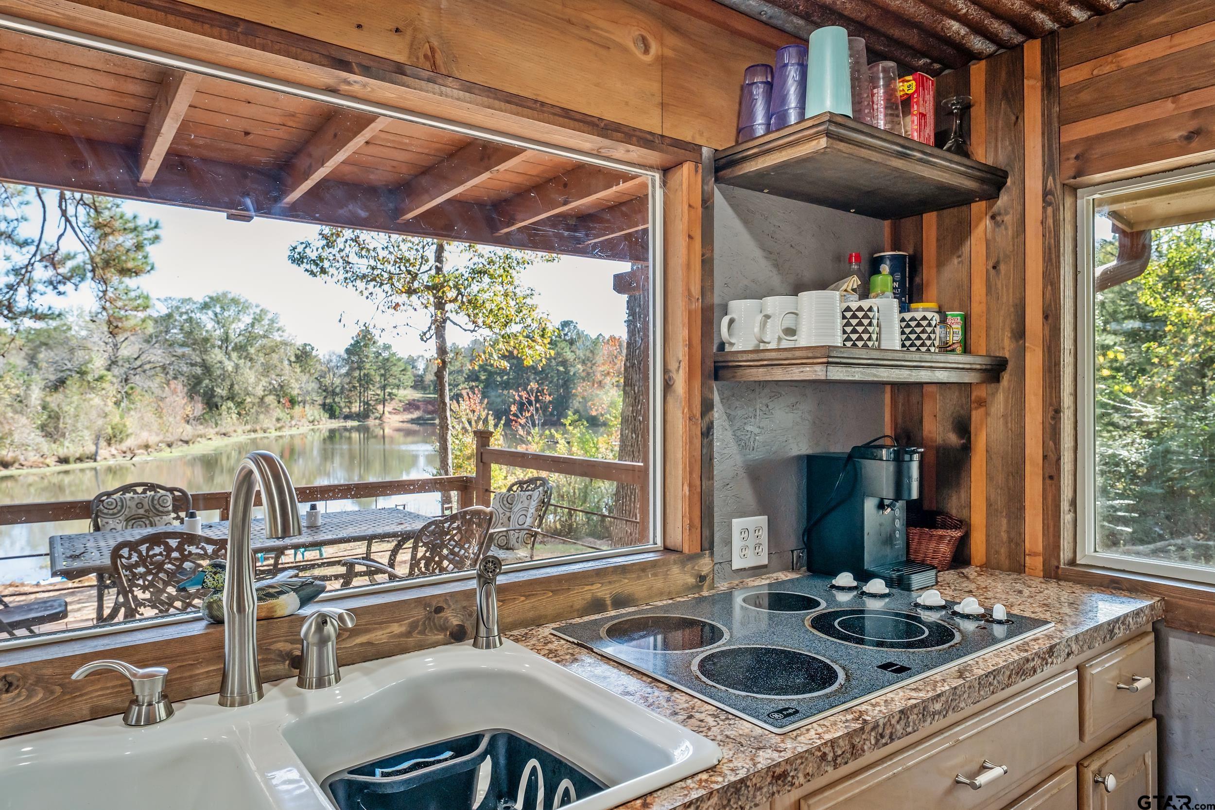 197 Cr 2304 Rusk Tx 75785 Rusk, TX 75785 - Photo 29 of 33 a table and chairs in the patio