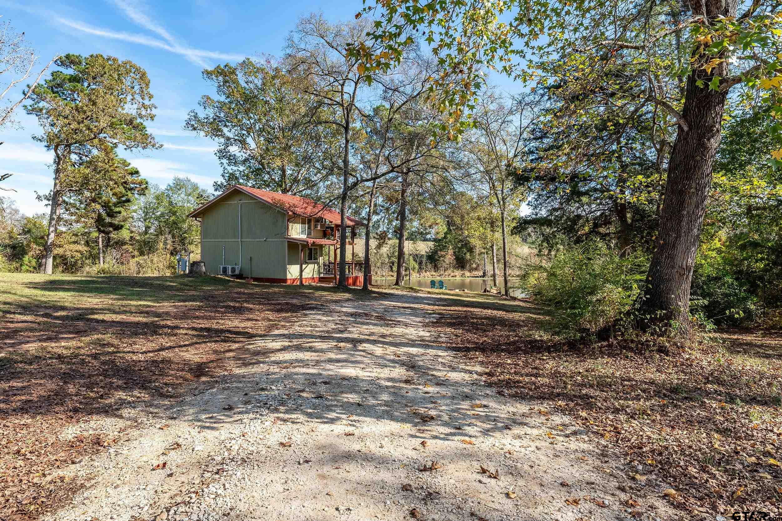 197 Cr 2304 Rusk Tx 75785 Rusk, TX 75785 - Photo 3 of 33 a view of outdoor space with deck and tree