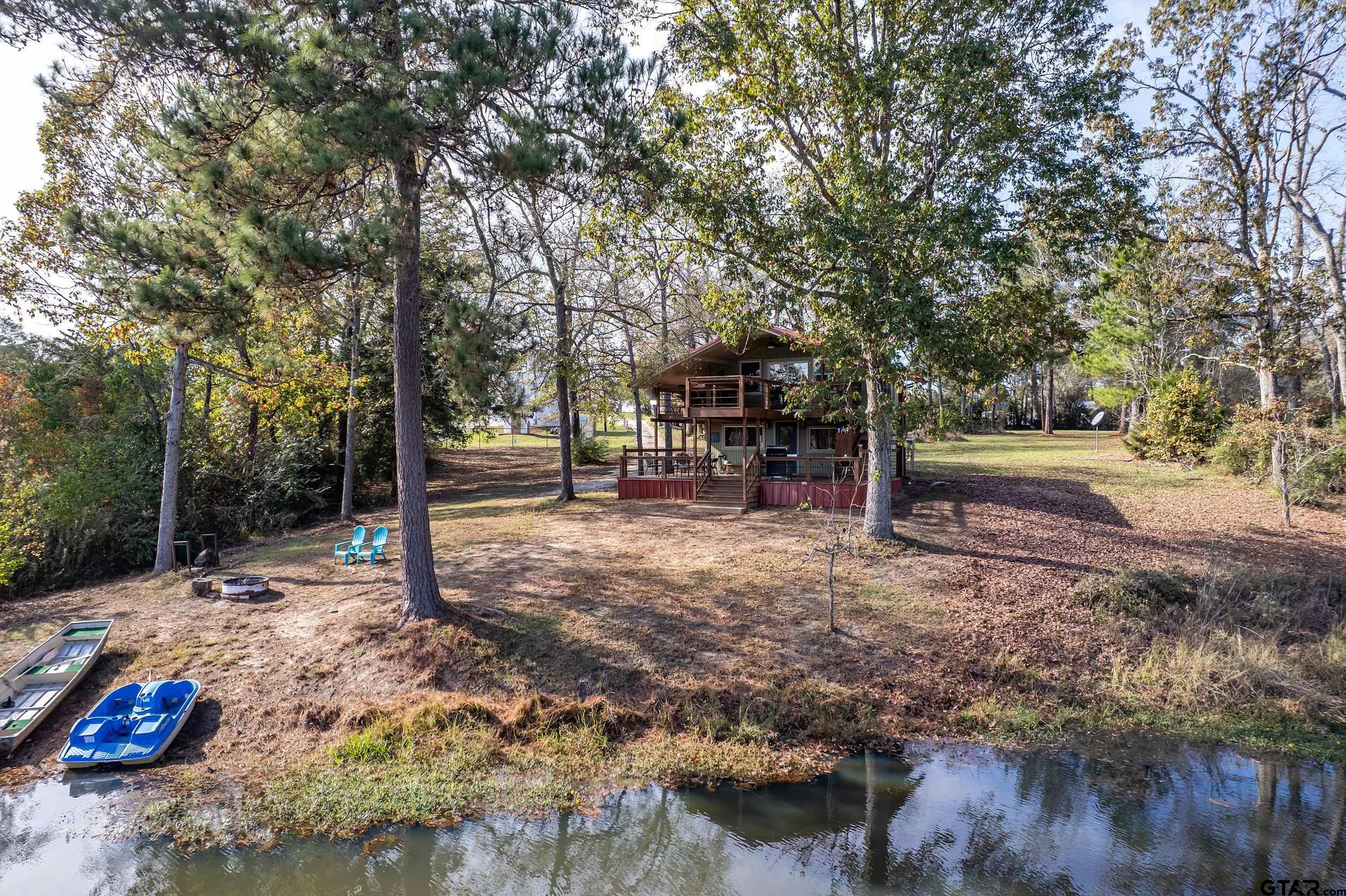 197 Cr 2304 Rusk Tx 75785 Rusk, TX 75785 - Photo 6 of 33 a backyard of a house with barbeque oven
