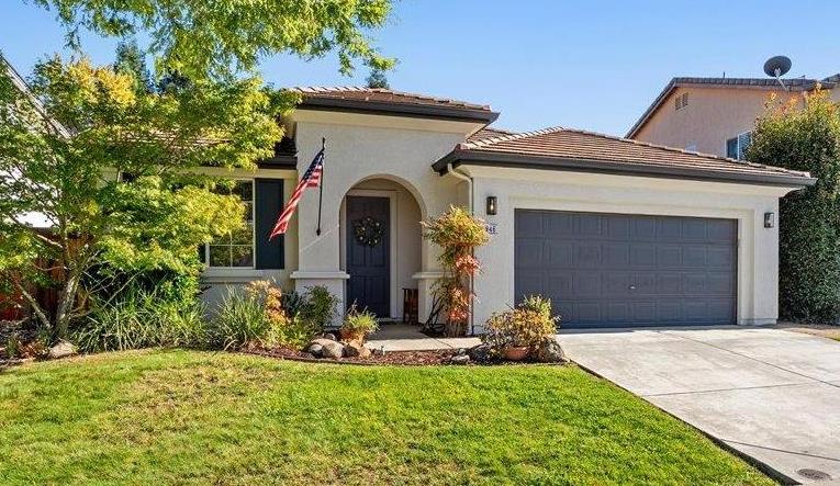 a front view of a house with a yard