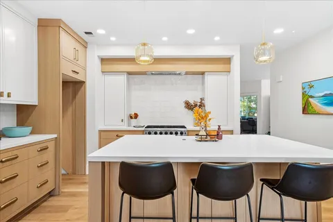 a kitchen with a table and chairs in it