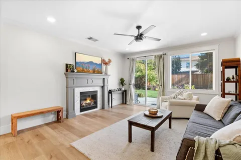 a living room with furniture and a fireplace