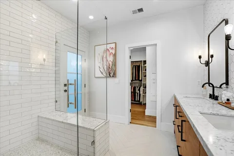 a bathroom with a bathtub and a shower