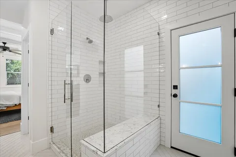 a bathroom with a double vanity sink and mirror