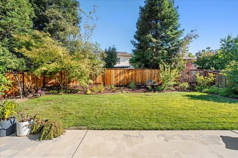 a front view of a house with swimming pool having outdoor seating