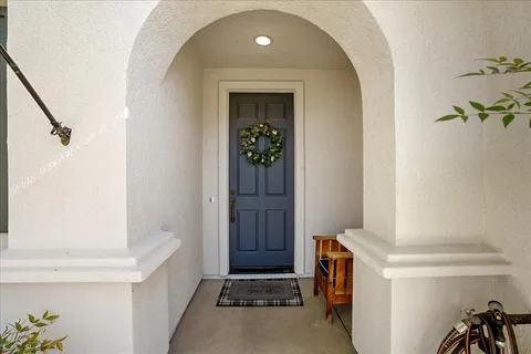 a view of an entryway with wooden floor