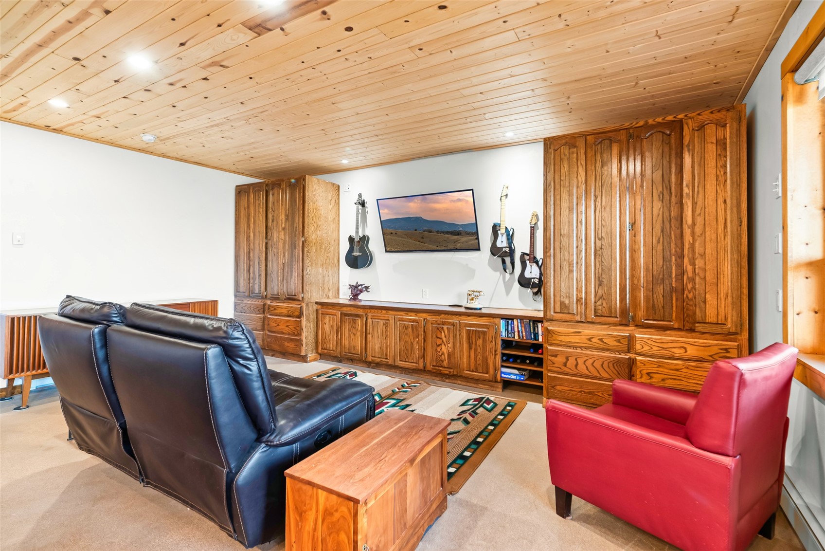 440 Arland Road Como, CO 80432 - Photo 26 of 49 a living room with furniture and a flat screen tv