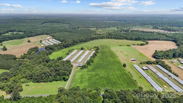 a view of a street with a grassy area