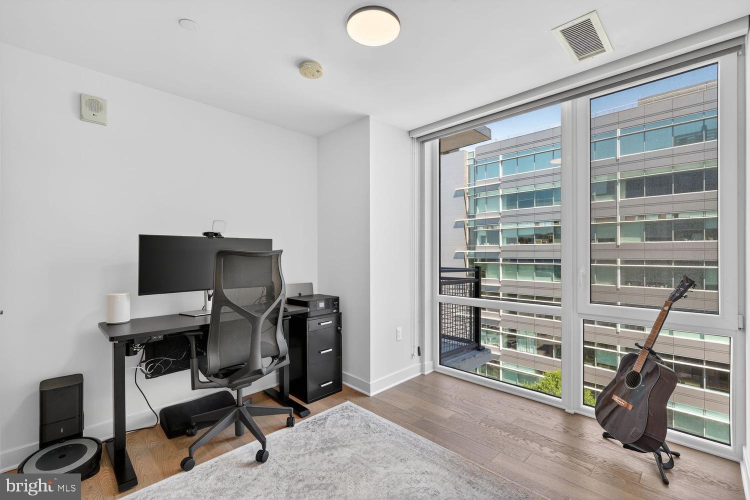 37 L Street Southeast, Unit 802 Washington, DC 20003 - Photo 12 of 23 a view of a workspace with furniture and a window
