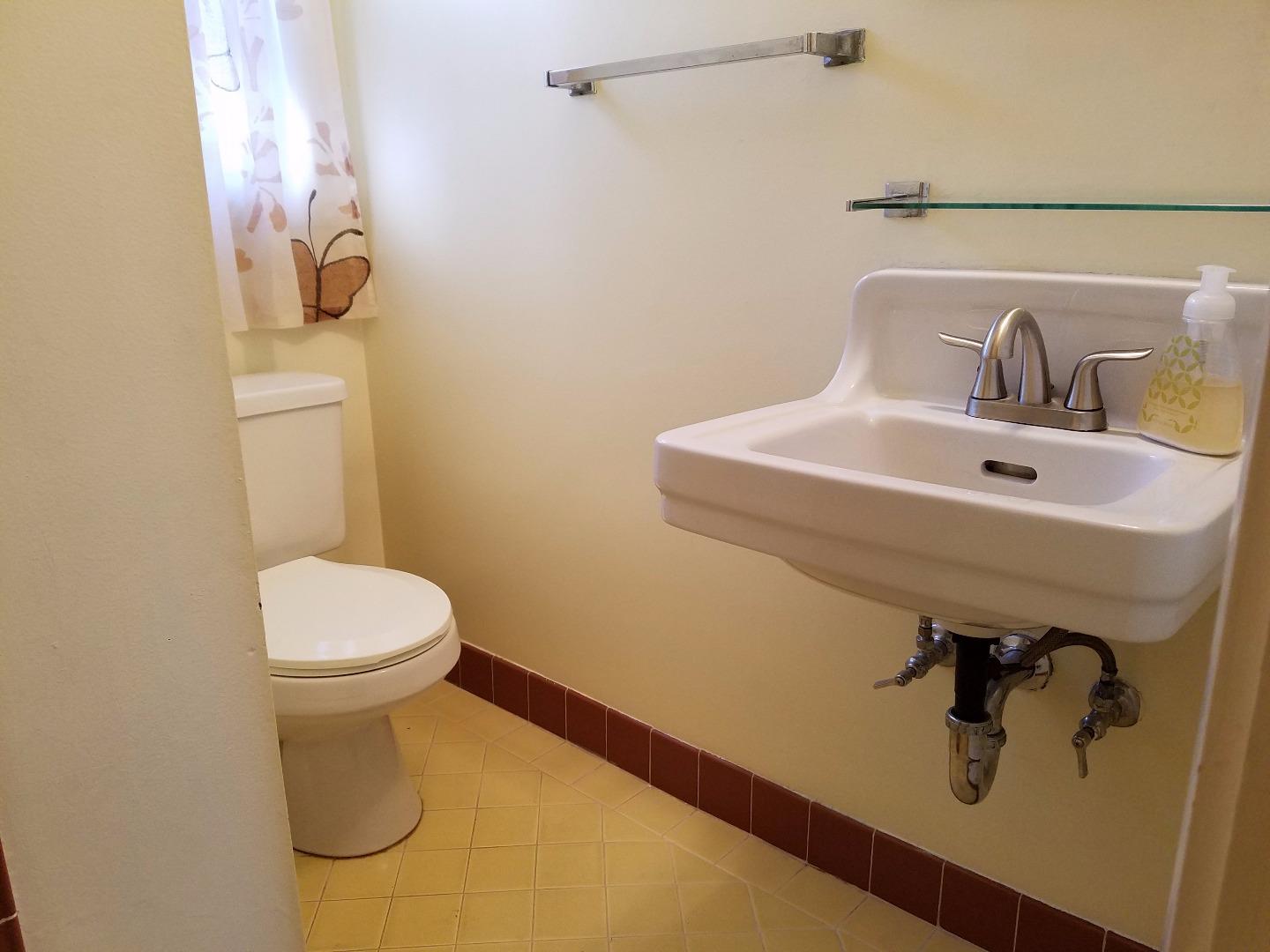 940 Black Mountain Road Hillsborough, CA 94010 - Photo 16 of 20 a bathroom with a sink and a toilet
