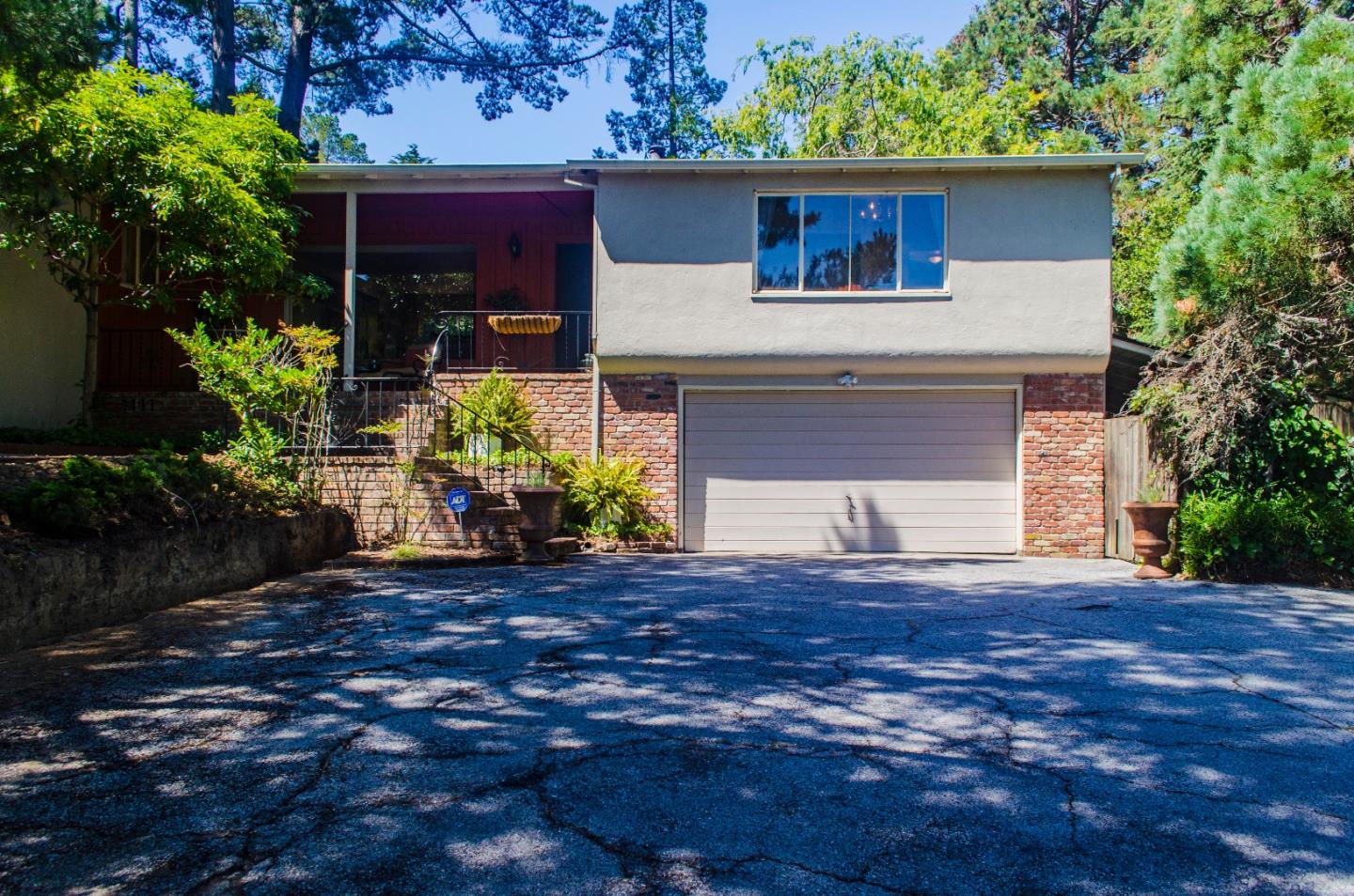 940 Black Mountain Road Hillsborough, CA 94010 - Photo 2 of 20 a front view of house with yard and trees in the background