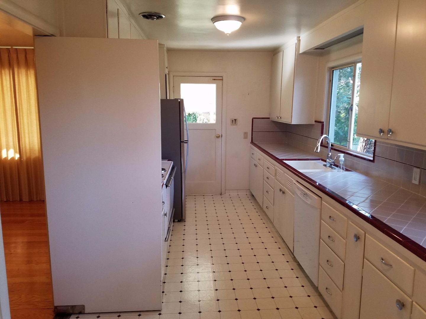 940 Black Mountain Road Hillsborough, CA 94010 - Photo 3 of 20 a bathroom with granite countertop a sink a toilet and a mirror