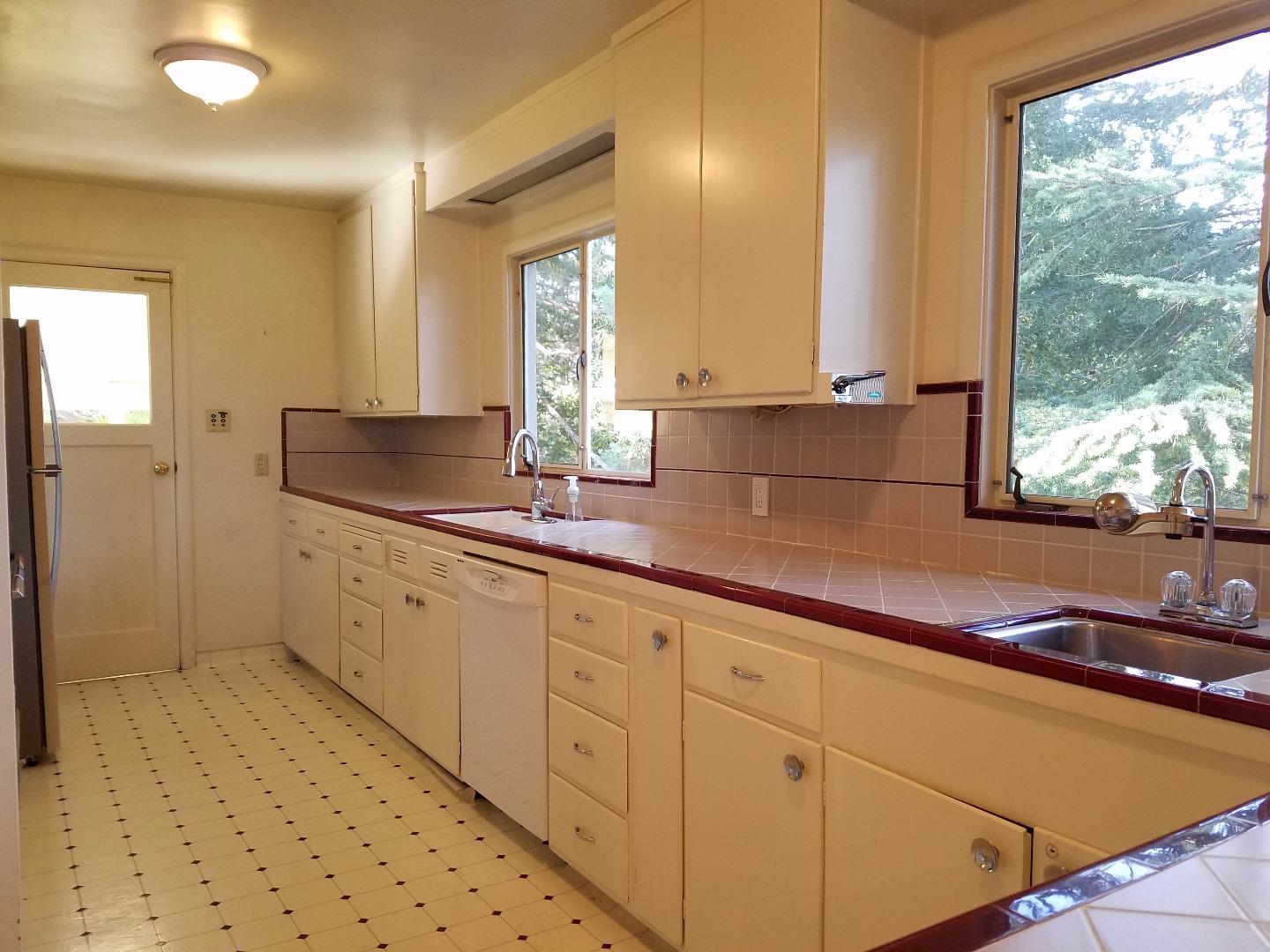 940 Black Mountain Road Hillsborough, CA 94010 - Photo 4 of 20 a bathroom with a sink and a mirror