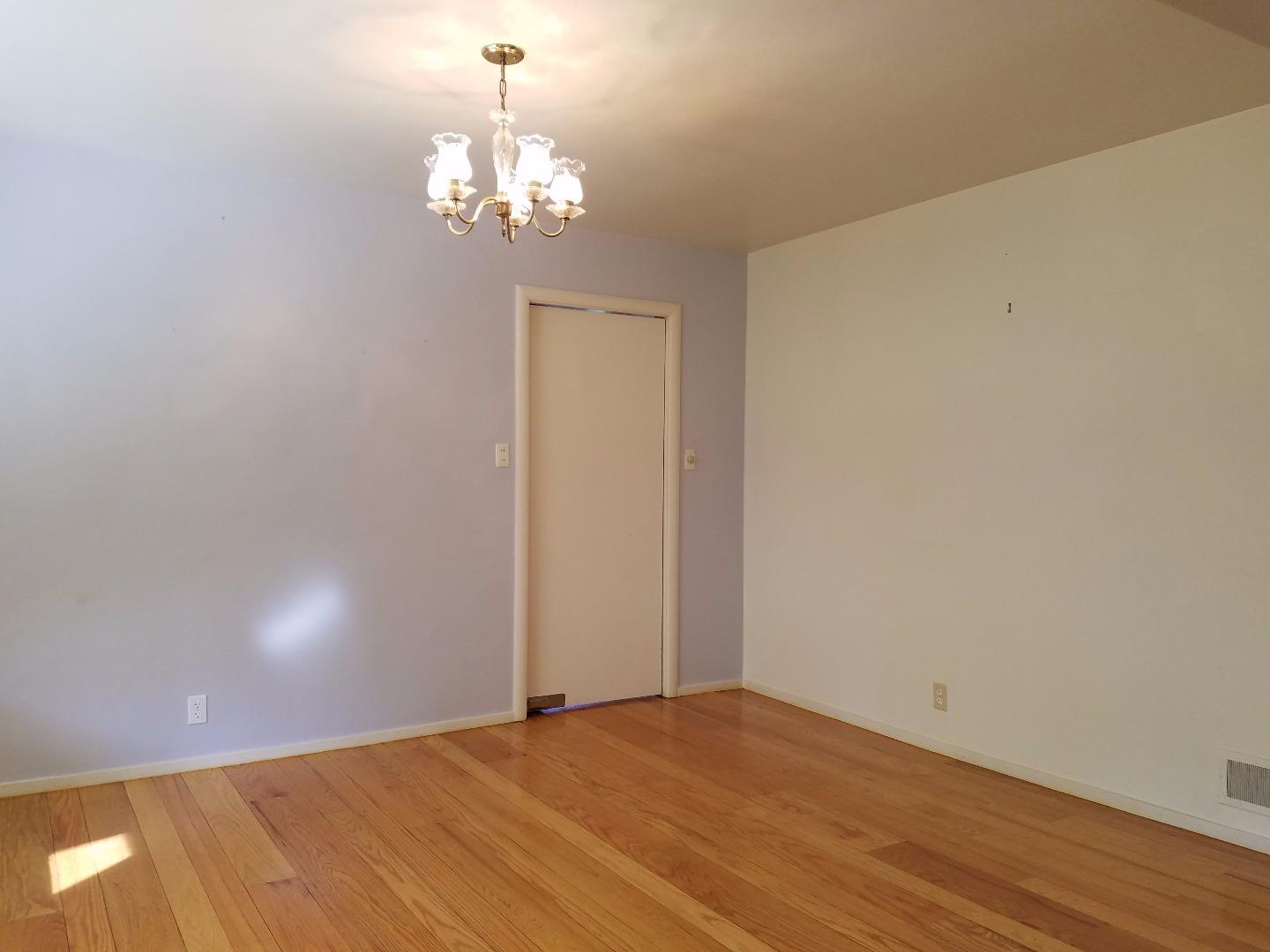 940 Black Mountain Road Hillsborough, CA 94010 - Photo 9 of 20 a view of empty room with wooden floor and fan