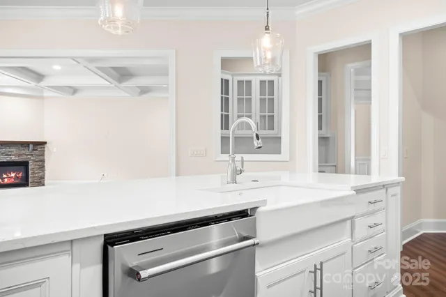 a kitchen with a sink and a refrigerator