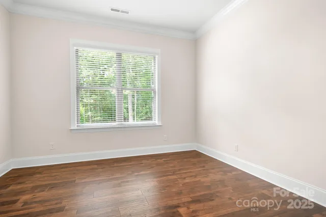 a spacious bedroom with a bed and a couch