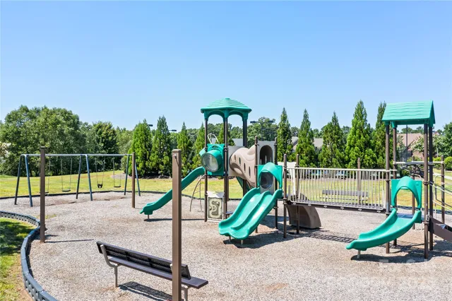 a view of a tennis court with chairs