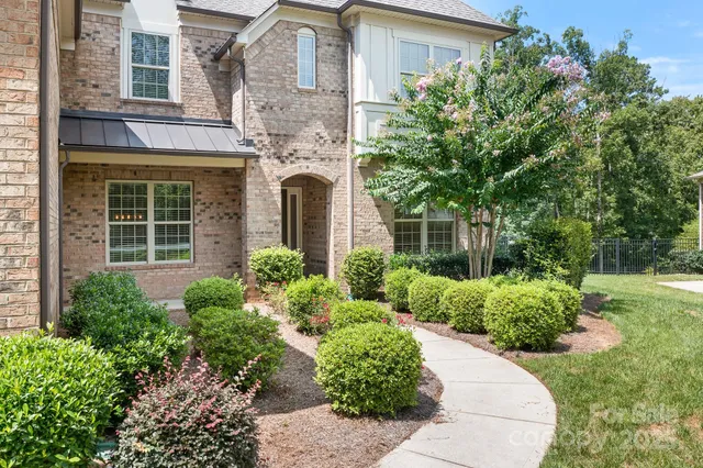 front view of a house with a garden