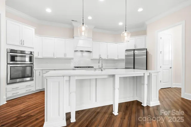 a kitchen with counter top space cabinets and stainless steel appliances