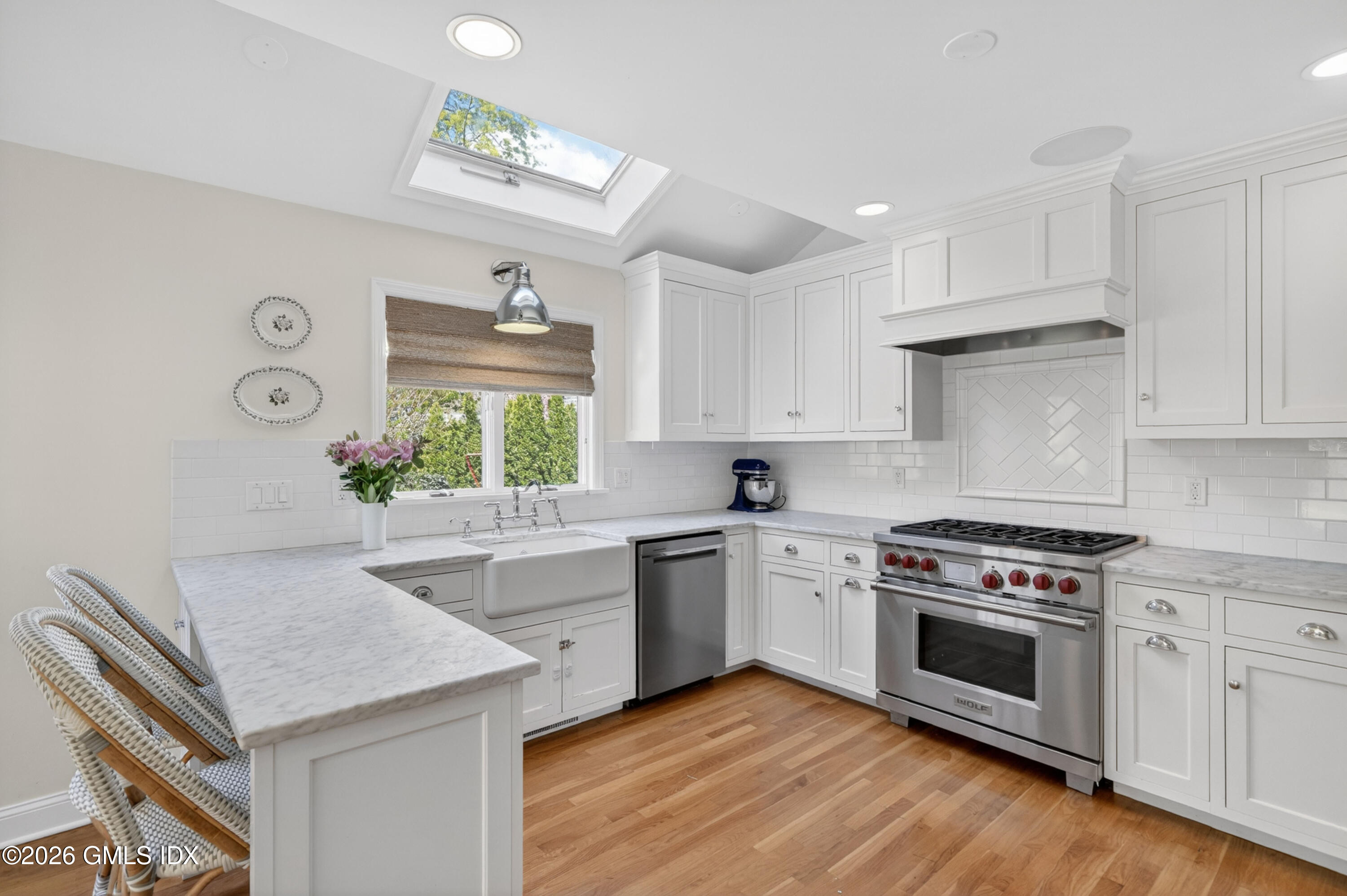 20 Ridge Road Cos Cob, CT 06807 - Photo 13 of 36 a kitchen with a stove cabinets and wooden floor