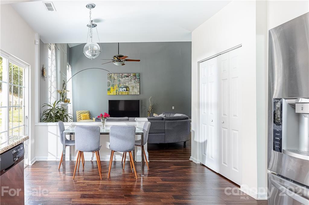 9239 Hillston Ridge Road Huntersville, NC 28078 - Photo 11 of 38 a view of a dining room with furniture window and wooden floor