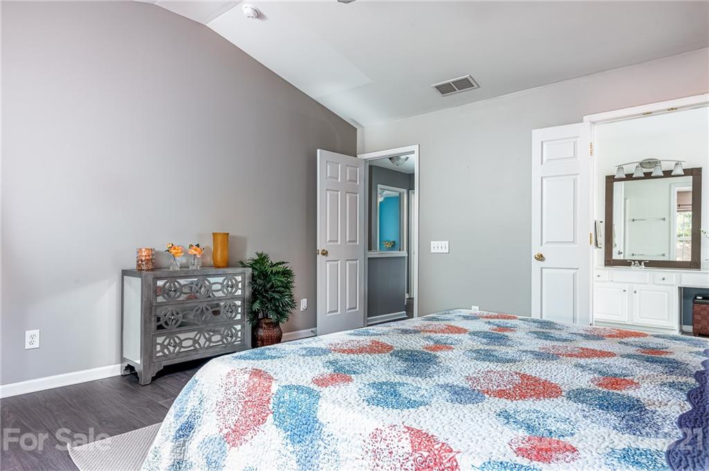 9239 Hillston Ridge Road Huntersville, NC 28078 - Photo 19 of 38 a bedroom with a bed and a dresser