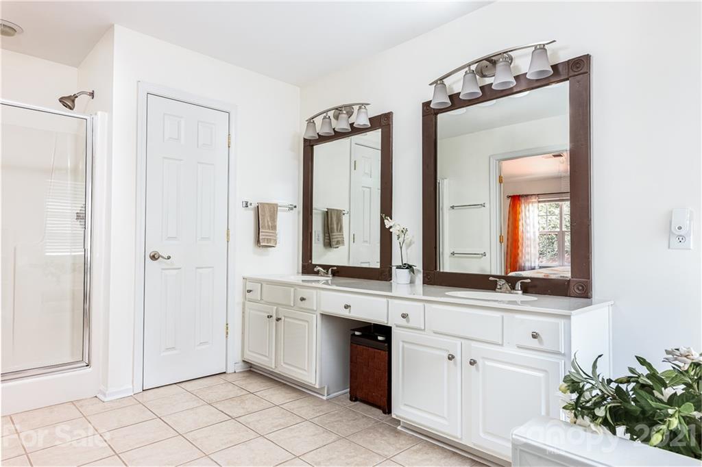 9239 Hillston Ridge Road Huntersville, NC 28078 - Photo 21 of 38 a spacious bathroom with a double vanity sink mirror and