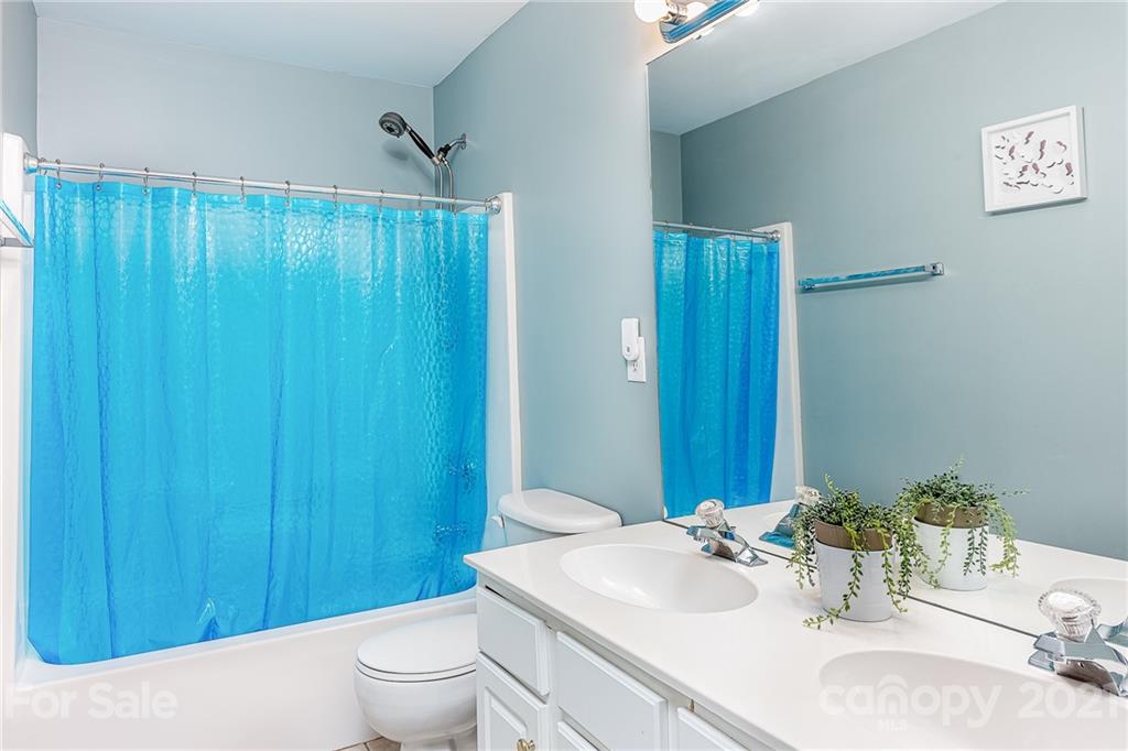 9239 Hillston Ridge Road Huntersville, NC 28078 - Photo 26 of 38 a bathroom with a sink a toilet and shower