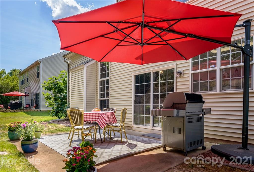 9239 Hillston Ridge Road Huntersville, NC 28078 - Photo 29 of 38 a view of a chairs and table in the patio