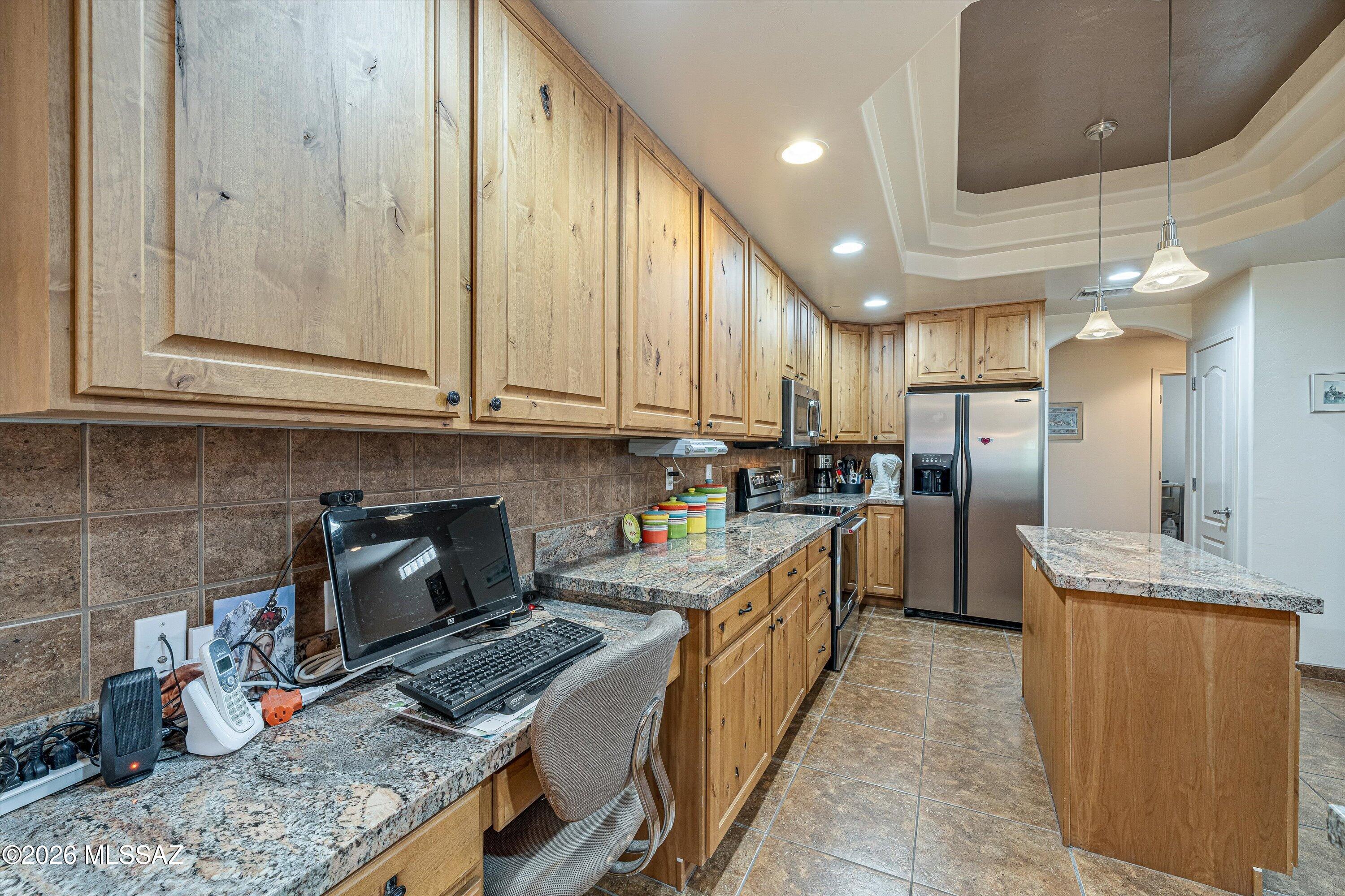 4677 East Rail N Road Tucson, AZ 85739 - Photo 11 of 48 Custom alder cabinets with granite countertops and sit up bar