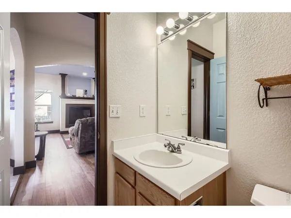 a en suite bathroom with a sink and a mirror