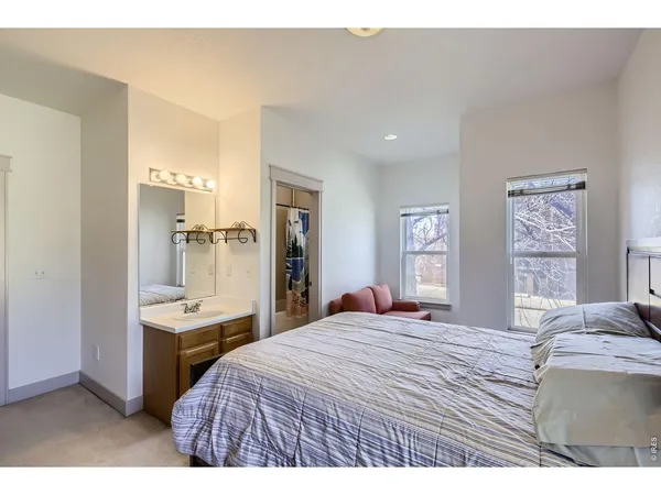 a bedroom with a bed and a table