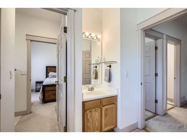 a en suite bathroom with a sink and a mirror