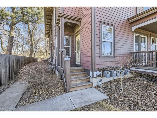 front view of a house with a bench