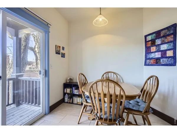 a view of a dining room with furniture and window