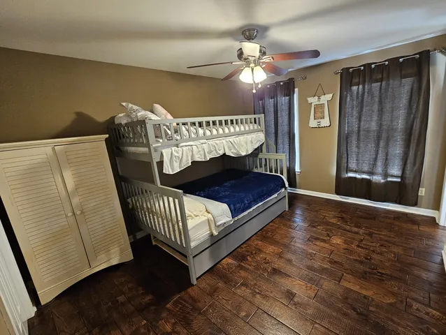 a bedroom with a bed and a mirror