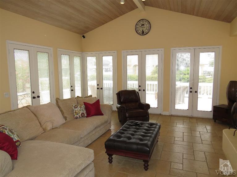 4047 Nice Court Oxnard, CA 93035 - Photo 19 of 31 a living room with furniture and a floor to ceiling window