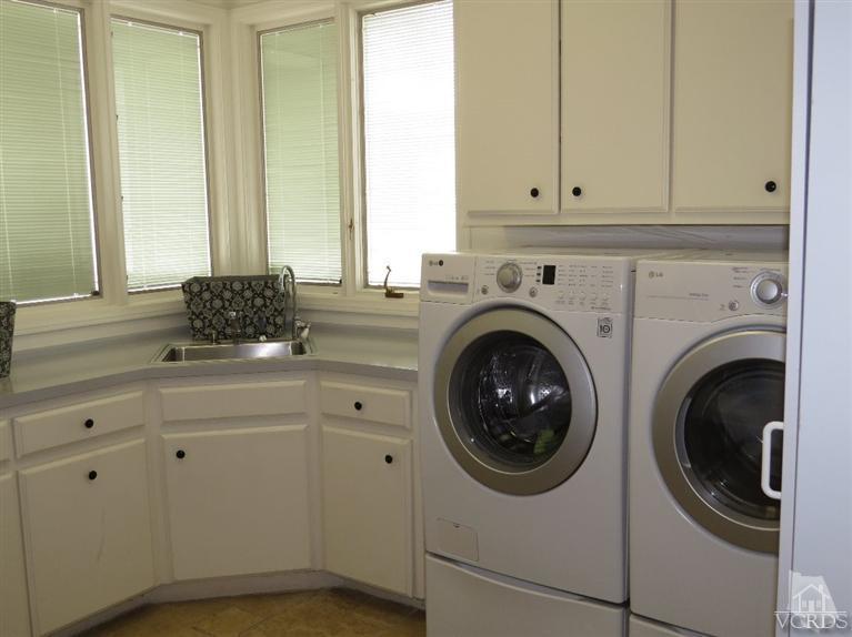 4047 Nice Court Oxnard, CA 93035 - Photo 24 of 31 a utility room with sink dryer and washer